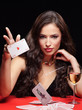 Photo: pretty young woman gambling on red table pretty young woman gambling on red table