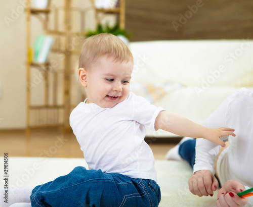 Photo: happy smiling and laughing boy at home happy smiling and laughing boy at home