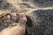 Touching the Cleopatra's Beach sand with the feet