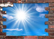 Cadre mur de briques, fond ciel et soleil