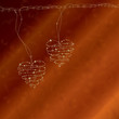 Romantic background with bright wire hearts