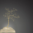Golden wire tree on a stone Golden wire tree on a stone