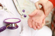 Doctor taking patient's pulse