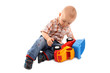 Little boy plays with toy