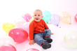 Little boy with colored balloons