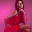 Fashion portrait of beautiful model wearing a cocktail red dress Fashion portrait of beautiful model wearing a cocktail red dress