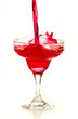 cocktail splashing into glass