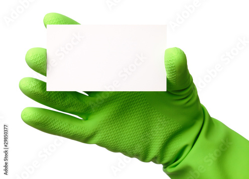 Photo: Hand in green glove showing business card Hand in green glove showing business card