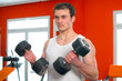 Photo: Man lifting dumbells Man lifting dumbells