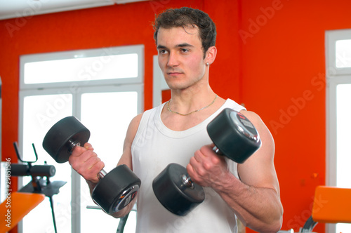 Photo: Man lifting dumbells Man lifting dumbells