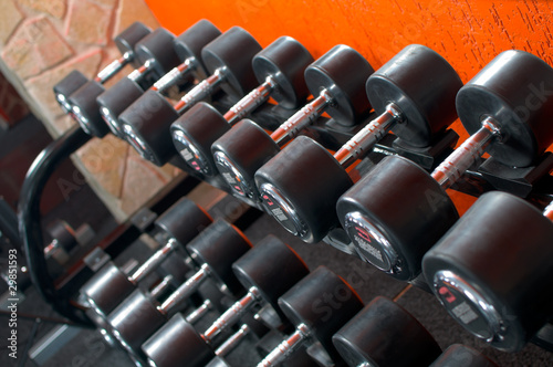 Photo: Dumbells on weights holder Dumbells on weights holder