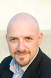 Head Shot 30's Bald Guy Goatee Looking at Camera