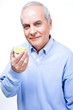 Man eating orange