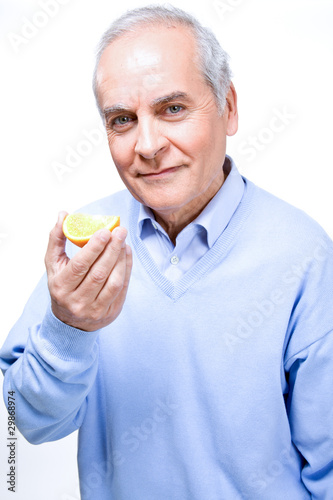 Man Eating Orange