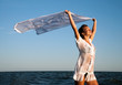 Girl with kerchief on the sunset. Relax scene Girl with kerchief on the sunset. Relax scene