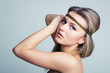 Beautiful woman holding gold jewelry band