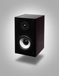 Speaker hanging in the air over gray background