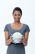 Businesswoman holding globe
