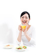 beautiful asian woman eating breakfast