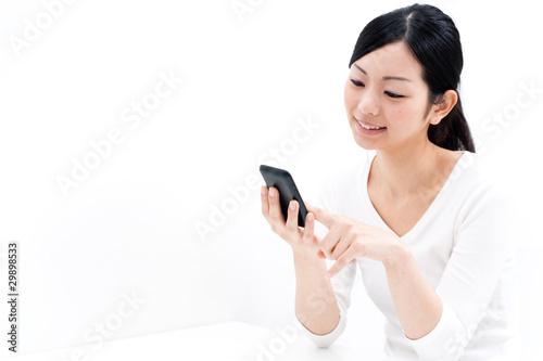 Photo: beautiful asian woman using cellphoe beautiful asian woman using cellphoe