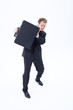 Foto: Businessman defending himself with briefcase Businessman defending himself with briefcase