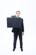 Serious businessman holding briefcase