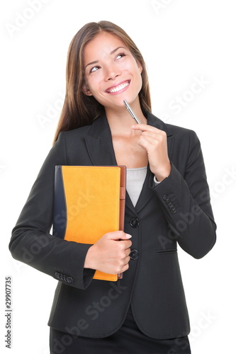 Photo: Real estate agent thinking - business decision Real estate agent thinking - business decision