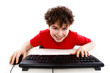 Boy using computer isolated on white background
