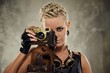 Close-up portrait of a steam punk girl with a photocamera
