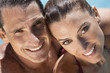 Beautiful Couple Relaxing In Swimming Pool With Perfect Smiles