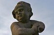Child with fish, statue in front of Moritzburg Castle Child with fish, statue in front of Moritzburg Castle