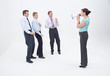 Photo: Female manager talking to businessmen with megaphone Female manager talking to businessmen with megaphone