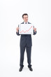Businessman holding ascending line chart