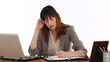 Businesswoman calculating her bills and it makes her nervous