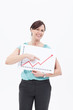 Smiling businesswoman holding ascending line chart