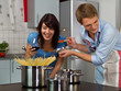Photo: Happy young couple in the kitchen Happy young couple in the kitchen
