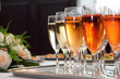 glasses of champaign on the tray with a bouquet