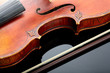 Violin and bow on dark background