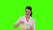 Cute brunette woman opening a gift