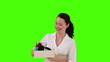 Brunette woman opening a gift