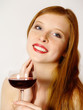 Foto: young woman with a red wine glass young woman with a red wine glass