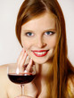 Foto: young woman with a red wine glass young woman with a red wine glass