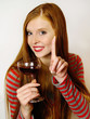 Foto: young woman with a red wine glass young woman with a red wine glass