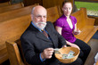 Senior Man Young Woman Putting Money Church Basket Senior Man Young Woman Putting Money Church Basket