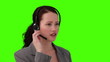 Dark-haired woman talking on the phone