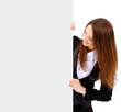 Isolate of a business woman standing beside a blank