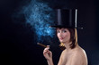 Photo: backlight picture of topless brunettel smoking cigar backlight picture of topless brunettel smoking cigar