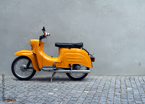 Photo: Yellow Motorbike by Grey Concrete Wall Yellow Motorbike by Grey Concrete Wall