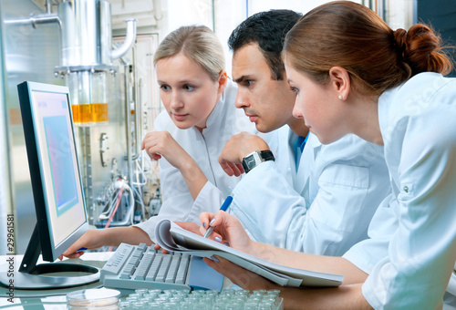 Photo: group of scientists working at the laboratory group of scientists working at the laboratory