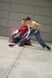 Boys Playing Hockey On Driveway